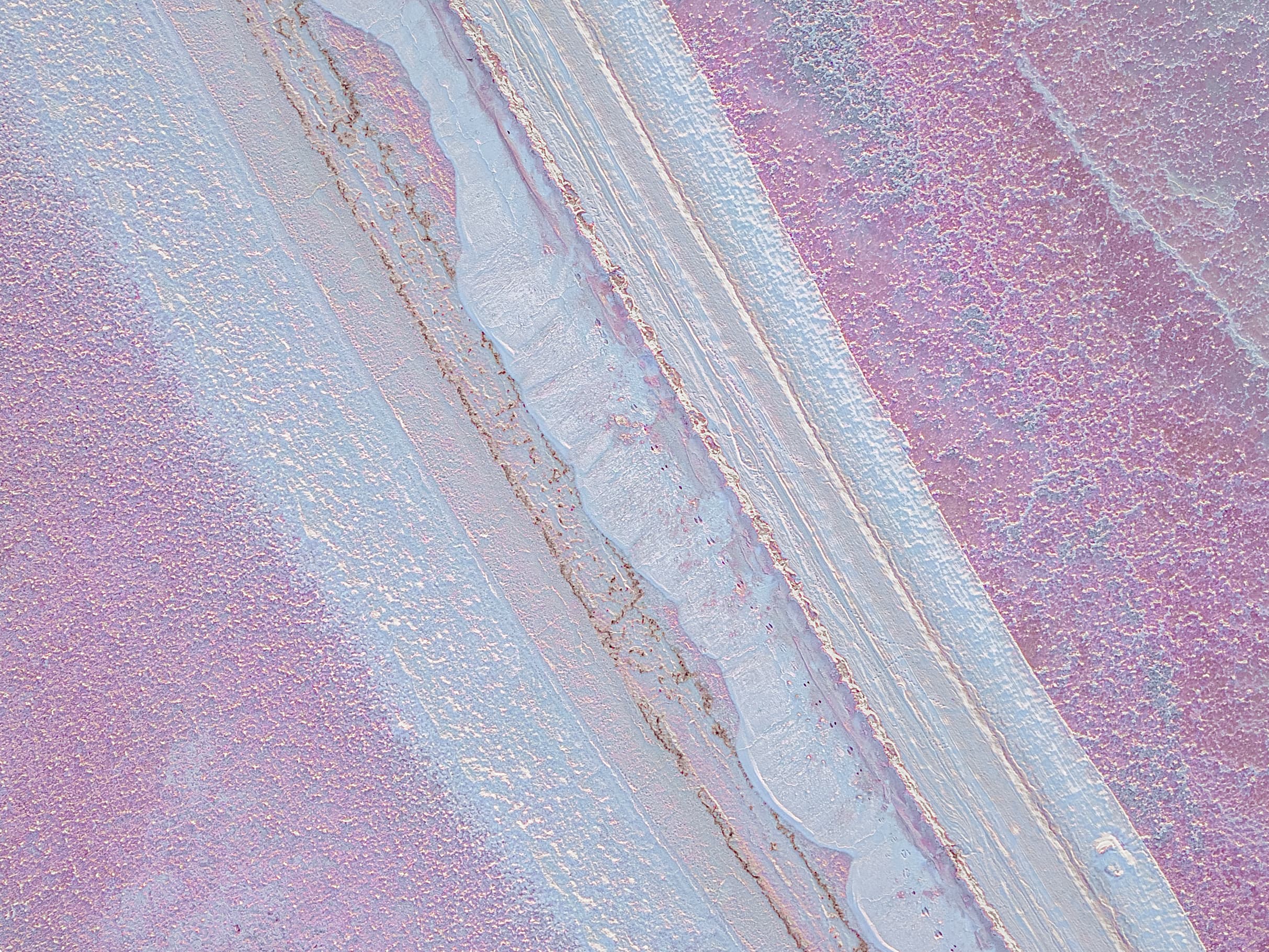 Colourful sediment layers across a salt flat